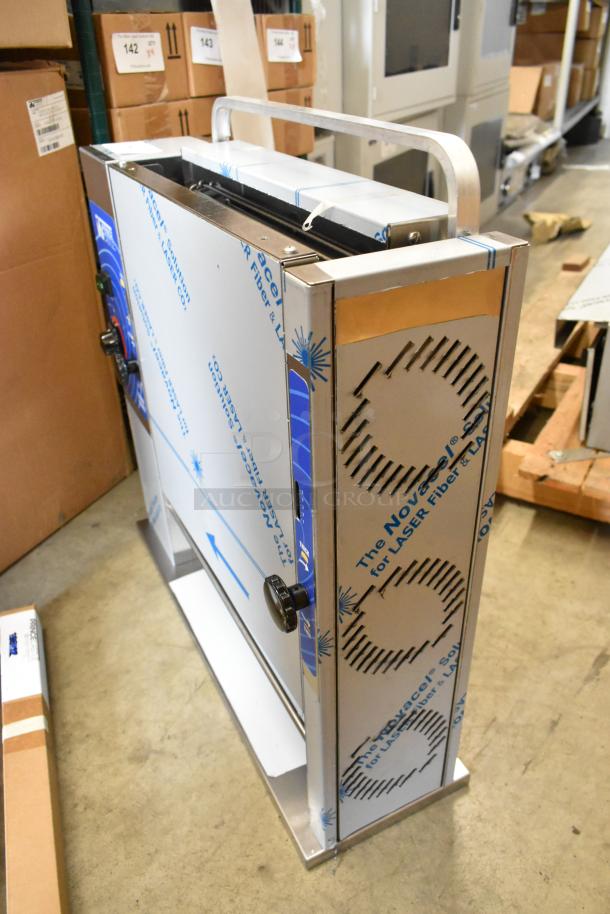 Brand new Prince Castle 296-T55JACK stainless steel commercial vertical toaster in box, 115 volts, 1 phase. Protective film visible.