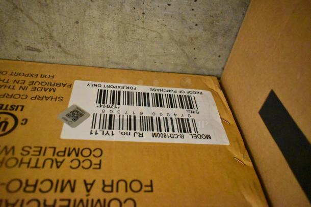Brand new Sharp R-CD1800M TwinTouch Commercial Microwave Oven in box. Label shows model and serial number for verification.