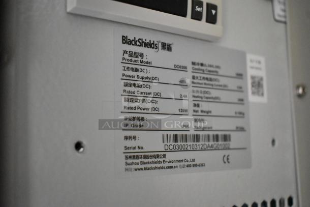 Brand new BlackShields DC0300 white metal cabinet, detailed label indicating model, power supply, and other specifications.