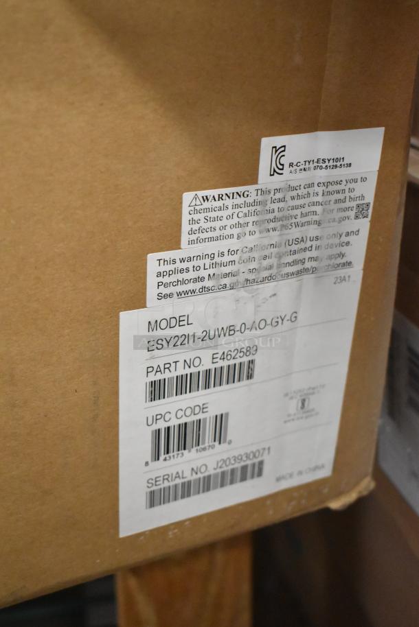 Brand new EloTouch ESY22I1-2UWB-0-AO-GY-G display, in box. Model info, warnings, and serial no. J203930071 shown.