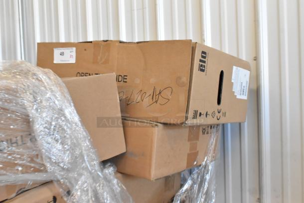 Boxes of two new EloTouch ESY22I1-2UWB-0-AO-GY-G displays and MicroTouch IC-215P-AA2 monitors, unopened.