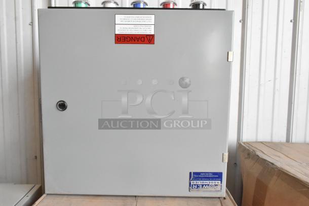 Brand new Power Assemblies gray metal box with "Danger" label, intact seals, and branding visible, unused condition.