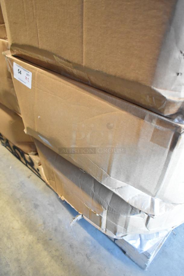 Boxes containing 2 brand new Power Assemblies gray metal boxes, unopened, showing outer packaging with a label marked "54".