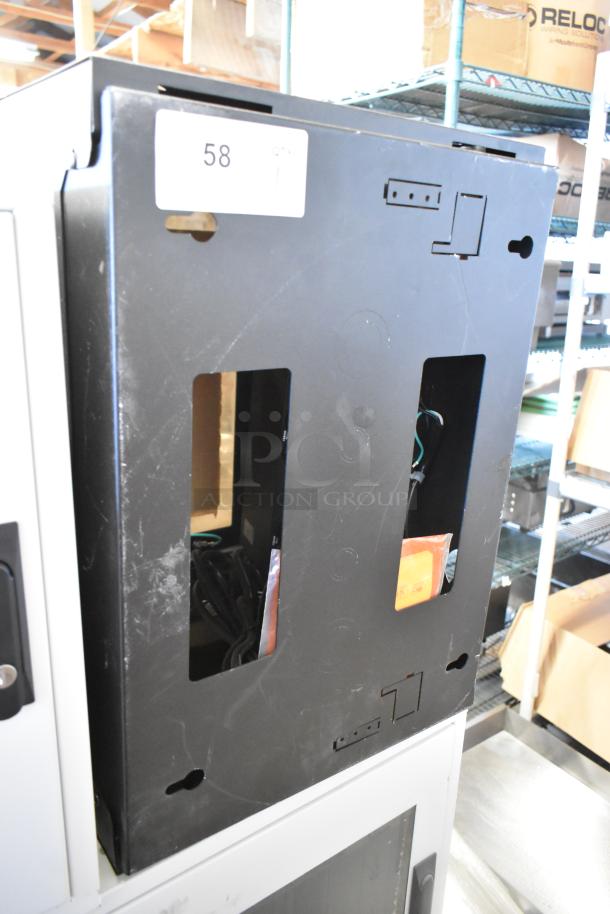 Brand new black metal enclosure system with side cutouts, wiring visible inside. Numbered label marked "58".