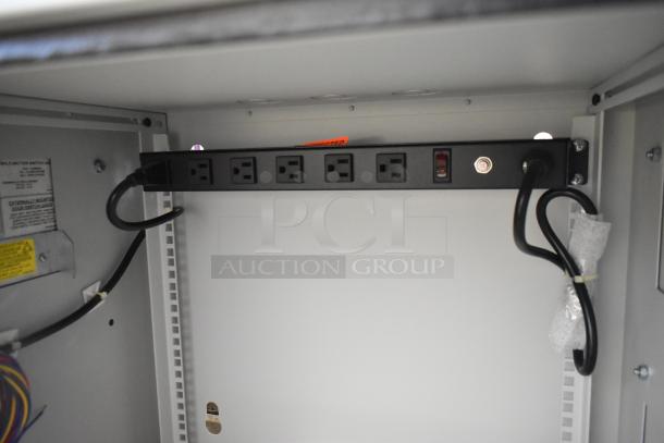 Brand new Hoffmann N170116G010 Spectracool Compact unit with Martin Box, 1025 BTU, 110/115V, 1 phase, shown inside with multiple outlets.