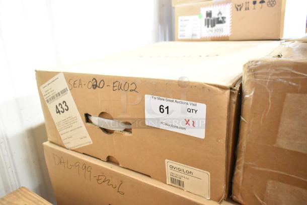 Two Avigilon VMA-AS3-8P4-NA appliances, new in box, with 4TB storage, 8 POE ports; auction lot labeled "61 X2".