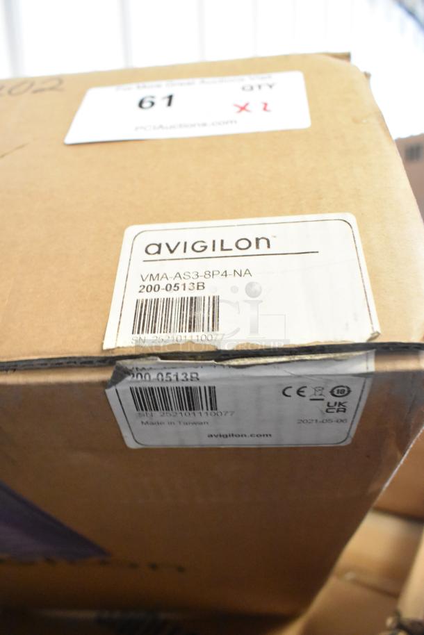 2 brand new Avigilon VMA-AS3-8P4-NA appliances, 8CH, 4TB storage, 8 POE ports. Box labeled with model, serial, details.