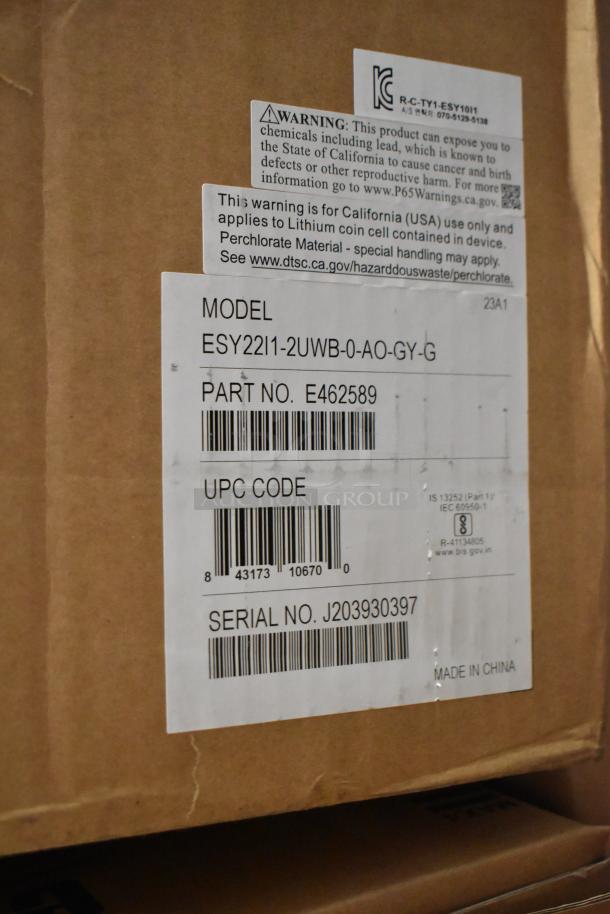 "Brand new EloTouch ESY22I1-2UWB-0-AO-GY-G display in box, labeled with model, part, UPC, and serial numbers."
