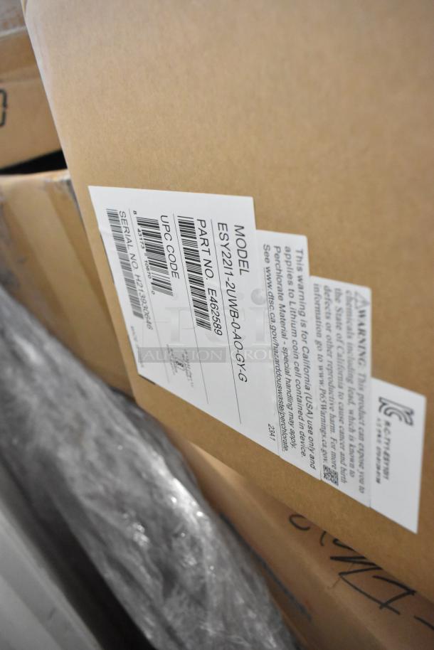 Brand new EloTouch ESY22I1-2UWB-0-AO-GY-G display in box. Label shows model, part number E462589, and UPC code.