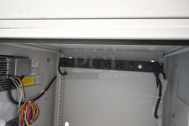 Hoffmann N170116G010 Spectracool Compact, 1025 BTU, 110/115V, new condition, wiring and power strip visible inside.