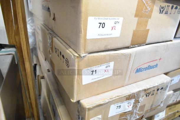 Boxes of brand new MicroTouch IC-215P-AA2 monitors, labeled "70" and "71," containing 2 units each.