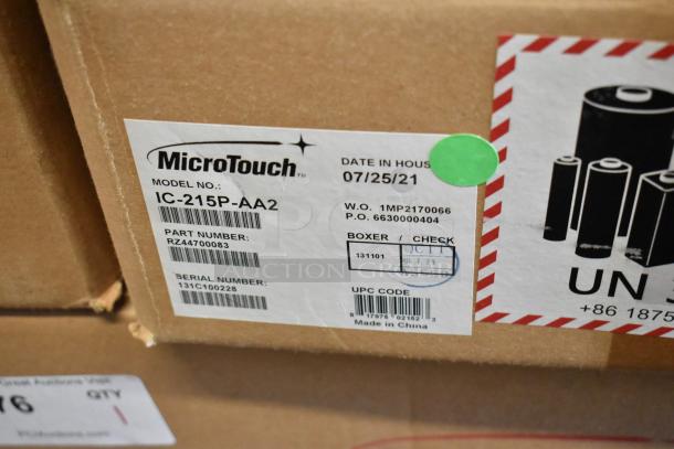 Brand new MicroTouch IC-215P-AA2 monitor in box. Model, part, and serial numbers visible on label. Dated 07/25/21.