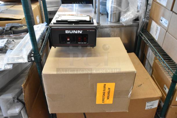 Brand new Bunn VP17-3 coffee machine in box. Stainless steel, 3 burners, 120V, 1 phase. “Attention Parts Enclosed” label on box.