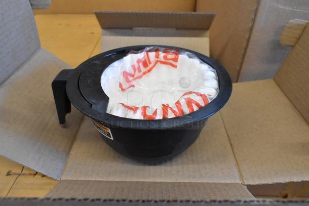 Bunn VP17-3 coffee machine filter basket wrapped in plastic, inside an open box.