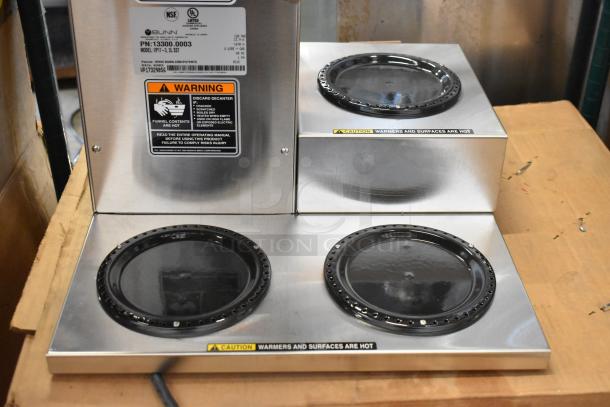 Bunn VP17-3 stainless steel coffee machine, brand new in box, 3 burners, 120 volts, commercial use, caution labels visible.