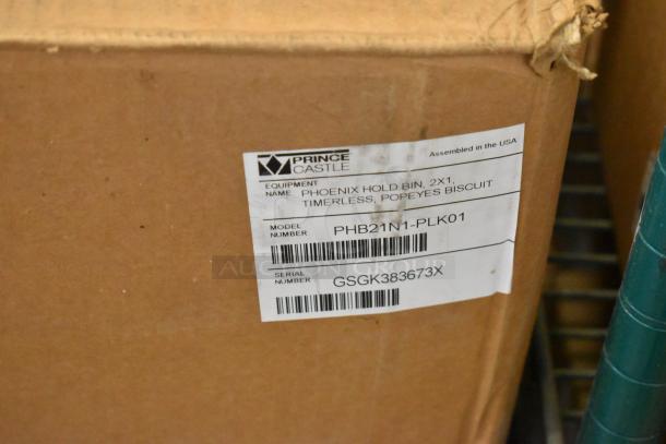 Brown box with label showing Prince Castle model PHB21N1-PLK01, stainless steel holding bin, serial GSGK383673X.