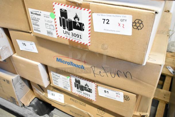 Brand new MicroTouch IC-215P-AA2 monitor in box, labeled with date 07/25/21. Box bears UN 3091 warning for batteries.