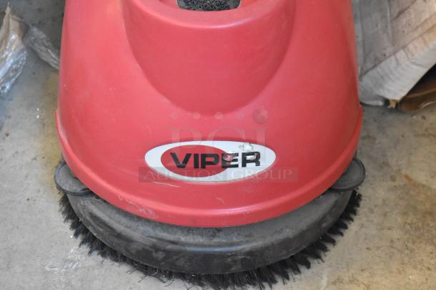 Viper FANG15B floor cleaning machine, red, visible logo. Used condition, featuring durable brushes.