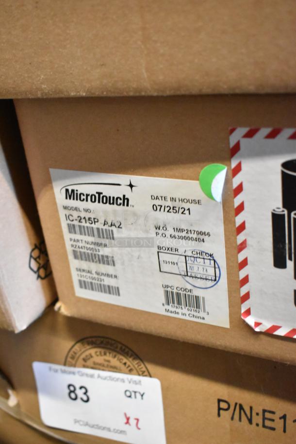 Brand new MicroTouch IC-215P-AA2 monitors in box, model number visible, labeled for auction, made in China.