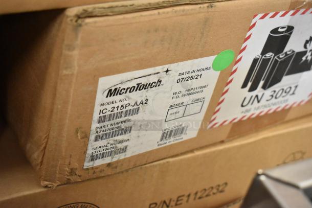 Brand new MicroTouch IC-215P-AA2 monitors in box; model and serial numbers shown; packed on 07/25/21.