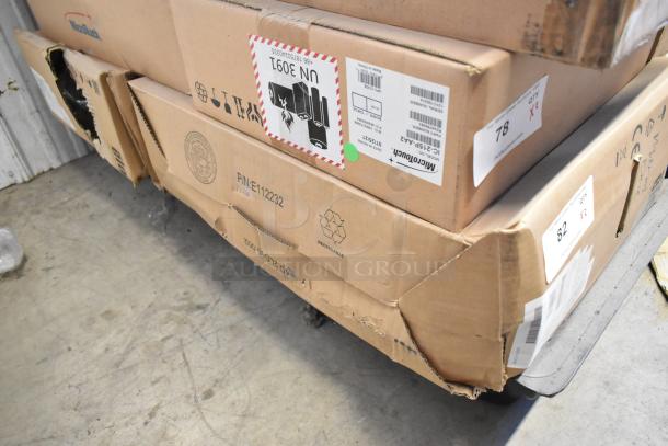 New in box EloTouch ESY22I1-2UWB-0-AO-GY-G Displays, labels show model number and packaging intact.