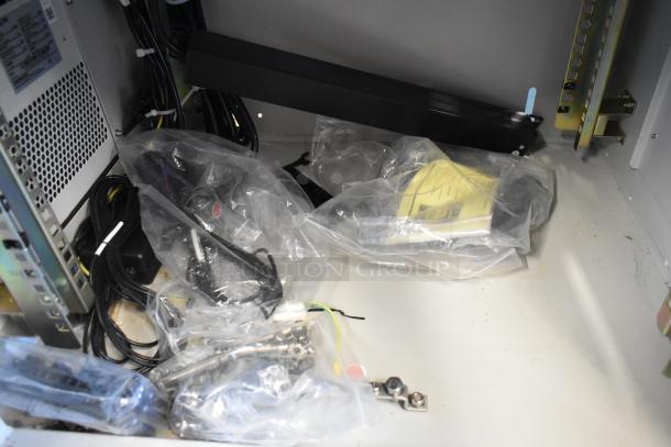 Brand new BlackShields DC0300 white metal cabinet with interior accessories in plastic packaging, indicating completeness and unused condition.