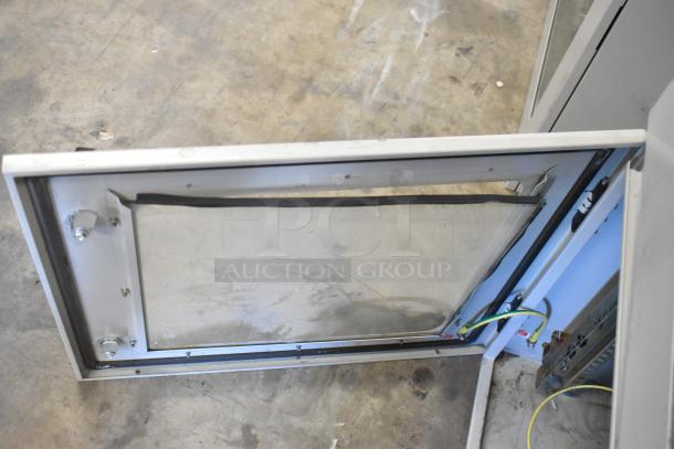 Brand new BlackShields DC0300 white metal cabinet, open view. Includes wiring, one missing key, pristine condition.