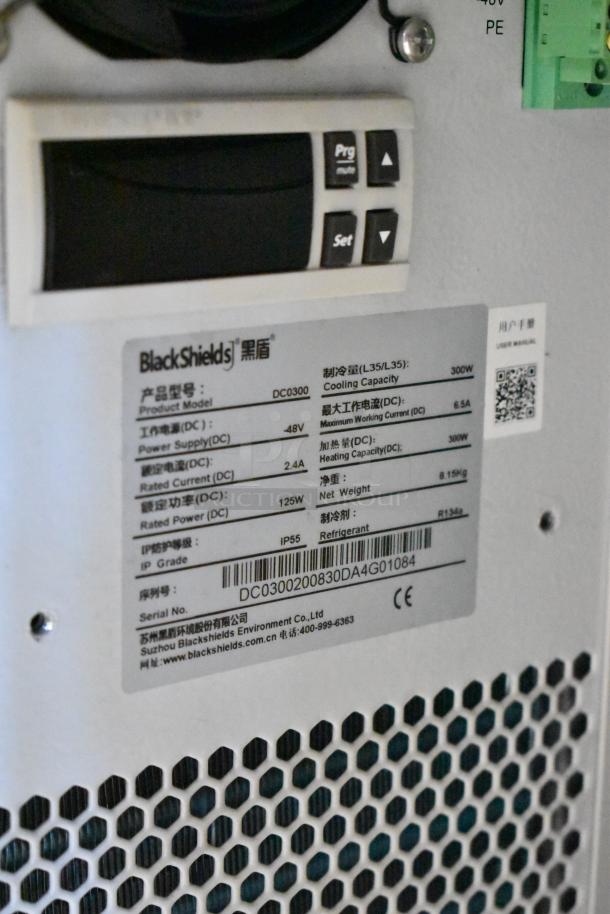 BlackShields DC0300 white metal cabinet; brand new, with 300W cooling capacity. Missing one key. Model and specs label visible.