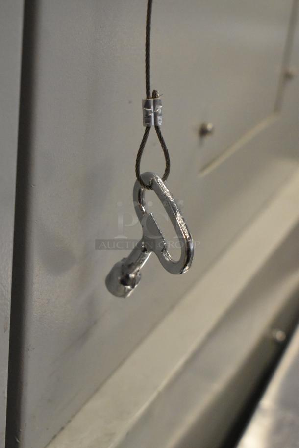 BRAND NEW! BlackShields DC0300 white metal cabinet with attached key on a cable.