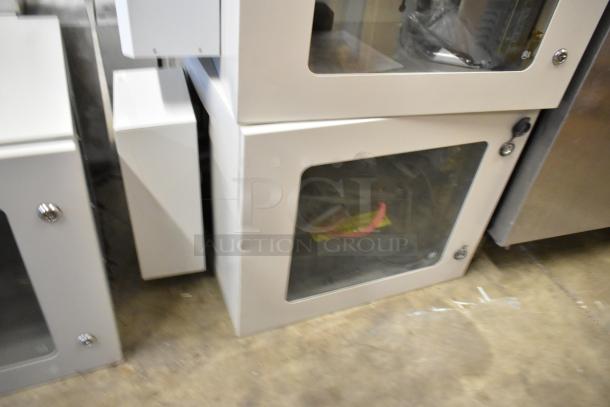 2 Brand New BlackShields DC0300 white metal cabinets with clear doors, missing keys. Durable, modern storage solution.