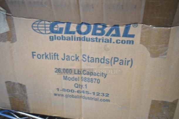 Brand new pair of Global 988870 forklift jack stands, 26,000 lb capacity. Packaging shows model and contact info.