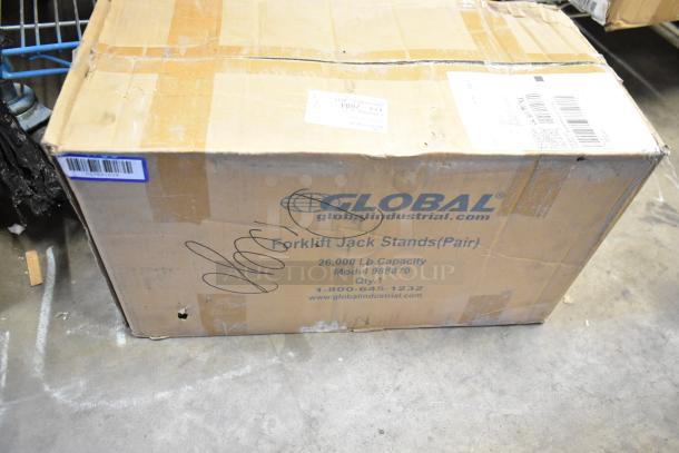 New Global 988870 forklift jack stand pair, 26,000 lb capacity, packaging intact, model visible on box.