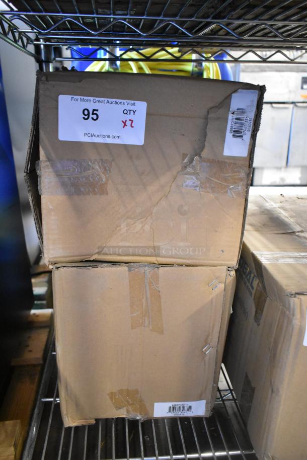 Two boxes containing Global 988870 forklift jack stands, 26,000 lb capacity, brand new. Labels display auction info and barcode.