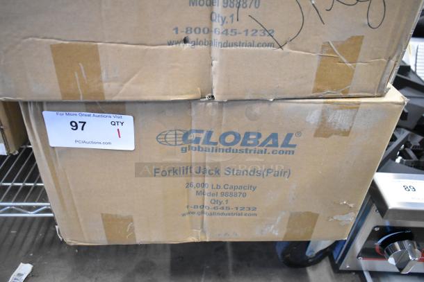 Brand new Global 988870 forklift jack stands, pair, 26,000 lb capacity, in original packaging with manufacturer’s labels visible.