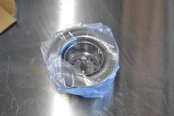 New Advance Tabco 7-PS-56 stainless steel sink component, wrapped in plastic on a metal surface.