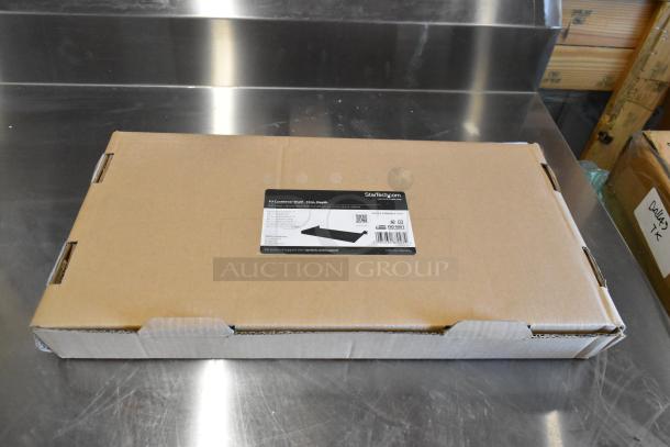 Brand new StarTech 1U Cantilever Shelf. Box shows model details and specifications.