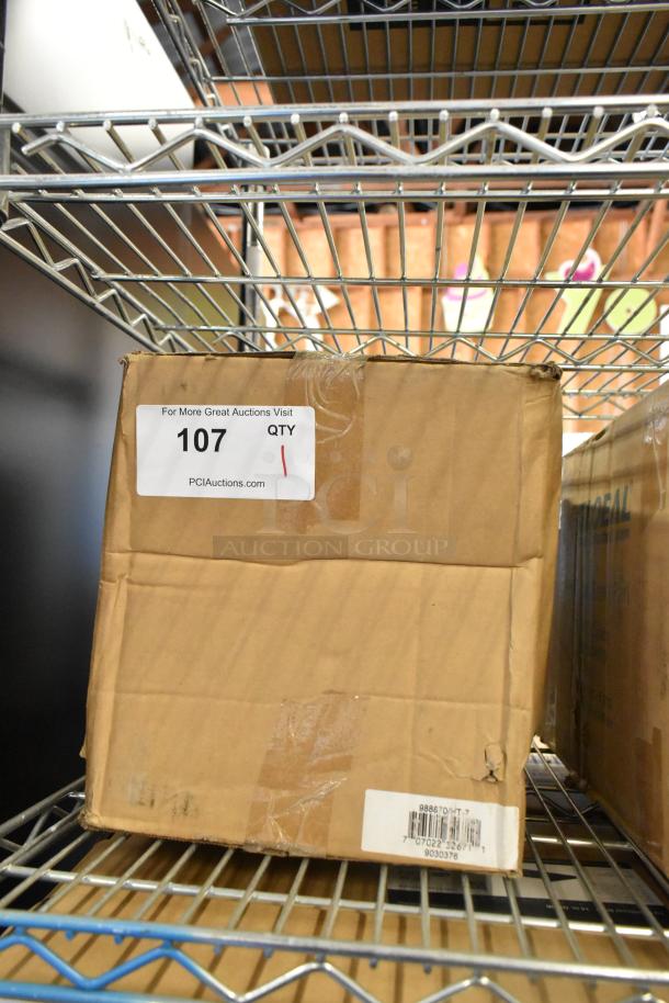 Box of brand new Global 988870 forklift jack stands, 26,000 lb capacity. Labels show auction info and barcode.