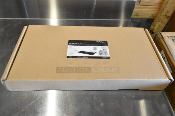 Brand new sealed StarTech 1U Cantilever Shelf in box. Label shows 10-inch depth, part #CABSHELF1U10, ISO 9001 certified.