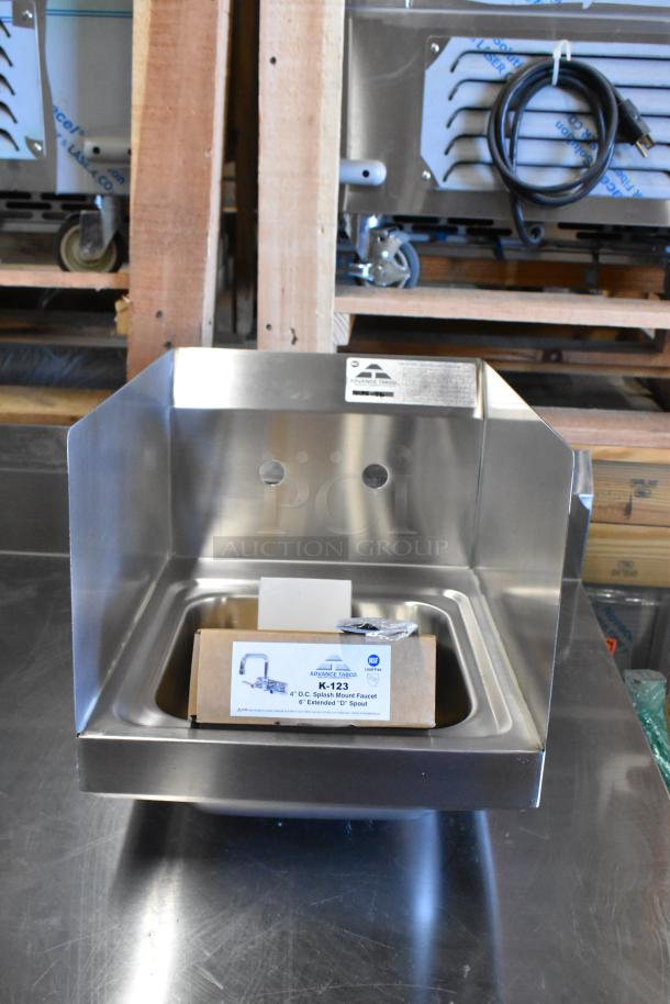 Brand new Advance Tabco 7-PS-56 stainless steel single bay wall mount sink with faucet in box, ready for installation.