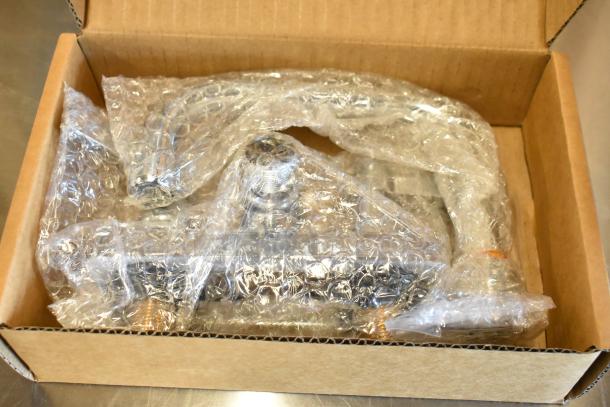 Brand new Advance Tabco 7-PS-56 stainless steel wall mount sink, bubble-wrapped in a cardboard box.