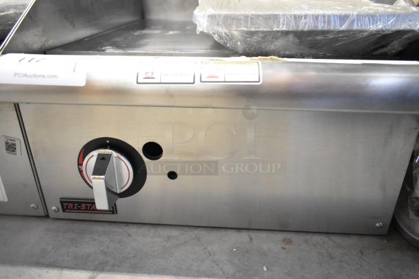 Stainless steel Tri Star TSGGM-18i commercial flat top griddle, new condition, with temperature control knob.