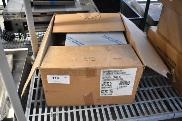 Brand new Henny Penny MPC-22 stainless steel holding bin in box. 120 volts, 1 phase. Box has model and specifications labels.