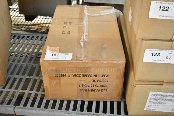 Box labeled "Made in Cambodia" containing brand new Cradle Point AER2200, Ruckus Access Point, and wiring, sealed with auction tag.