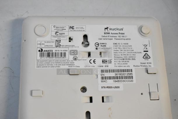 Brand new Ruckus R500 access point with labels indicating model, IP, and compliance details, part of a tech bundle.