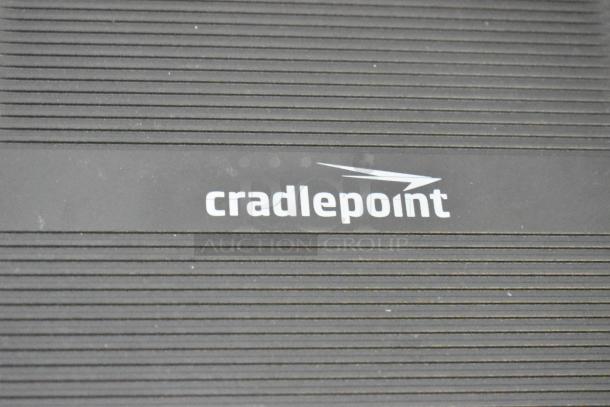 Cradle Point AER2200 unit close-up, featuring logo on striped casing. Brand new, part of a lot with Ruckus Access Point and wiring.