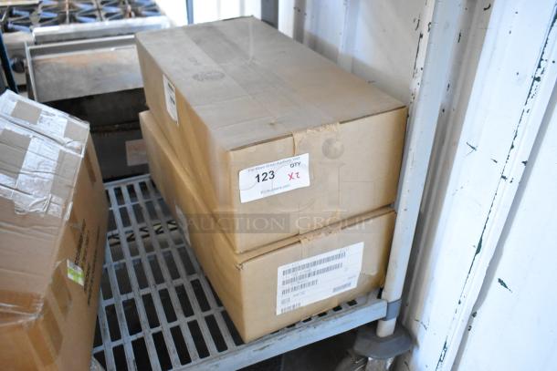 Two brand new Prince Castle 755-HM16 electric timers in sealed boxes, labeled for auction, 16-channel, 120V, 1-phase.