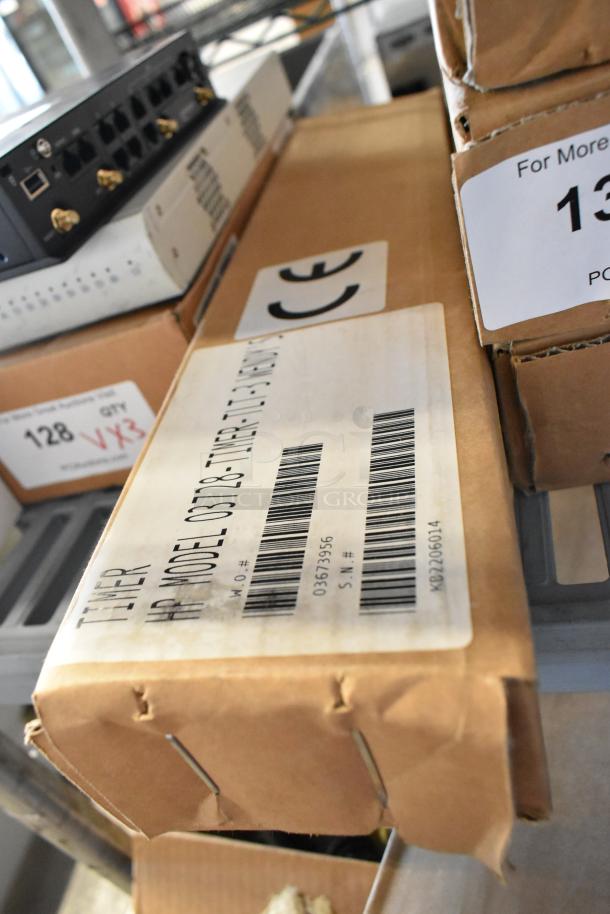 Three brand new HP 03728-TIMER-TLT-3 Lane Timers in boxes. Visible labels show model and barcodes.