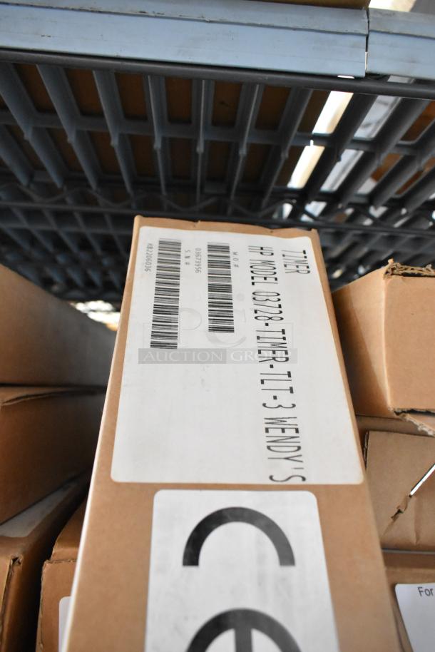 4 brand new HP 03728-TIMER-TLT-3 timers in original boxes, labeled for Wendy's, showing barcodes and model details.