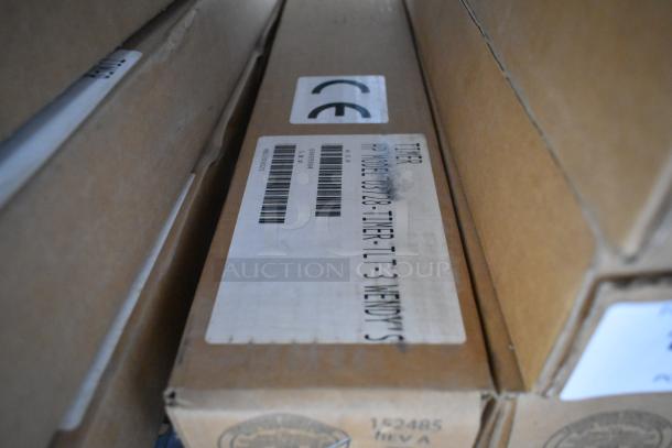 Four new HP 03728-TIMER-TLT-3 Three Lane Timers in boxes, labels visible, indicating model and CE compliance.
