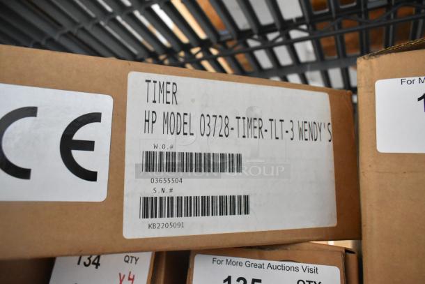 4 brand new HP 03728-TIMER-TLT-3 Three Lane Timers in boxes. Label shows model and serial numbers.